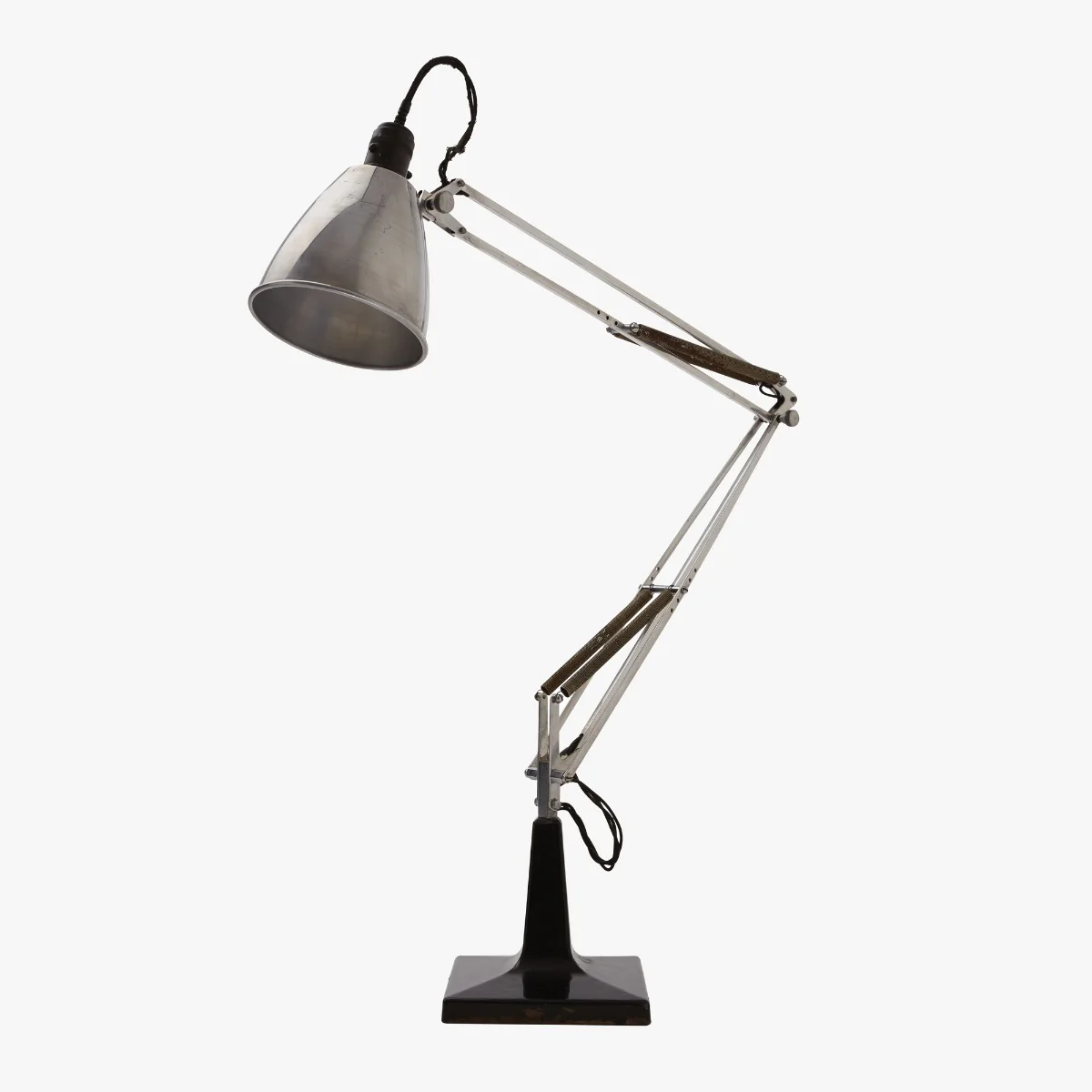 Anglepoise Lamp: An articulated desk lamp with a counterbalanced arm, conical shade, and weighted base.