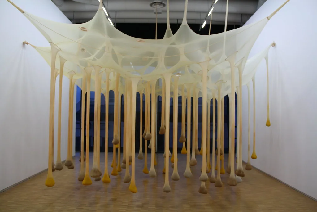 Centre Pompidou: A large rectangular building with exposed pipes, ducts, escalators, and coloured structural elements.