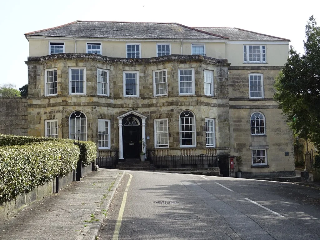 Georgian Townhouse: A balanced façade with sash windows, a strong doorway, and repeated floor levels.